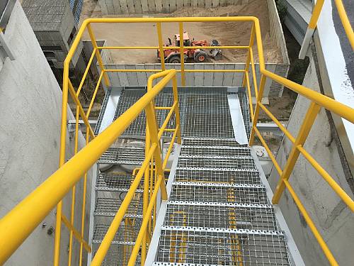 Repair of stairwell and protective barriers on reinforced concrete silos